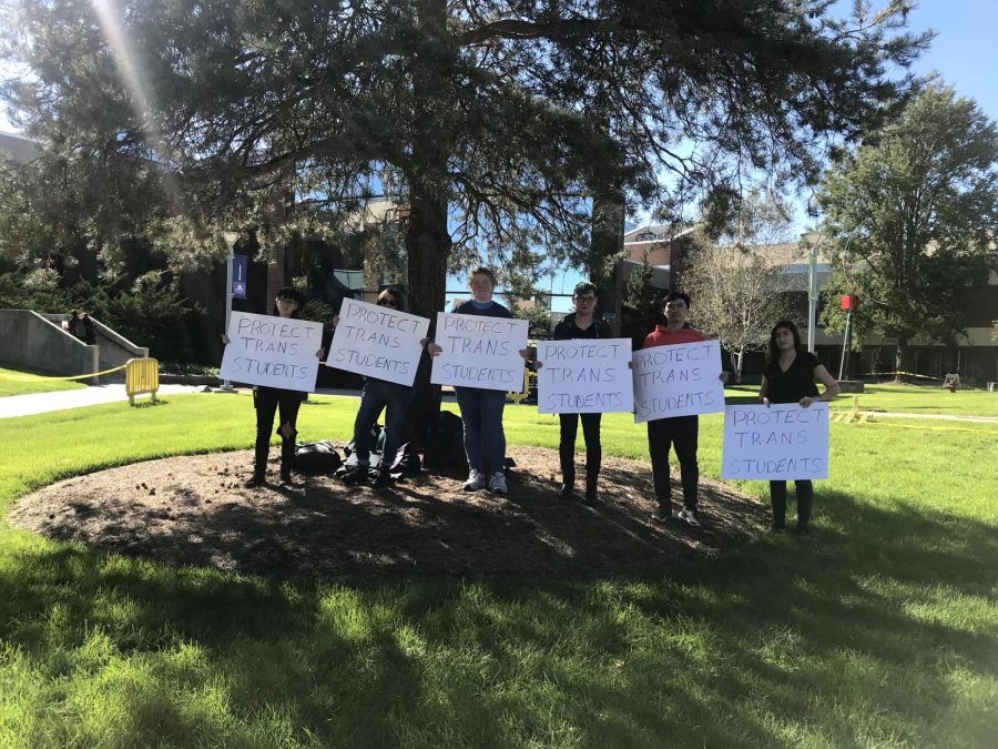 Six+Harper+College+Students+gathered+at+the+designated+protest+area+with+signs+stating+%E2%80%9CProtect+Trans+Students+on+the+day+of+Devos+visit.+%28Tara+Moorehouse%2FHarbinger+Media%29