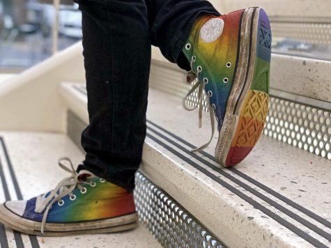 Many recognize Lane Crims colorful converse as walks around campus, paving a new path for trans students on campus. Photo By Grace Garlick 