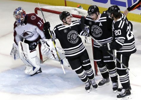 Left to right: Alex DeBrincat, Duncan Keith, and Brandon Saad of the Chicago Blackhawks celebrate in their Winter Classic sweaters after scoring a goal against the Colorado Avalanche on Friday November 29th, 2019.