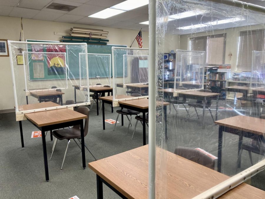 Dividers made of PVC pipe and shower curtains stand on socially distanced tables at Immanuel
Lutheran School on October 9, 2020. Photo courtesy of Maggie Walsh.