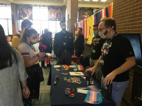 Students and staff interact at tables at Harpers Pride Fest on Oct. 11, 2021. (photo by Adriana Briscoe)