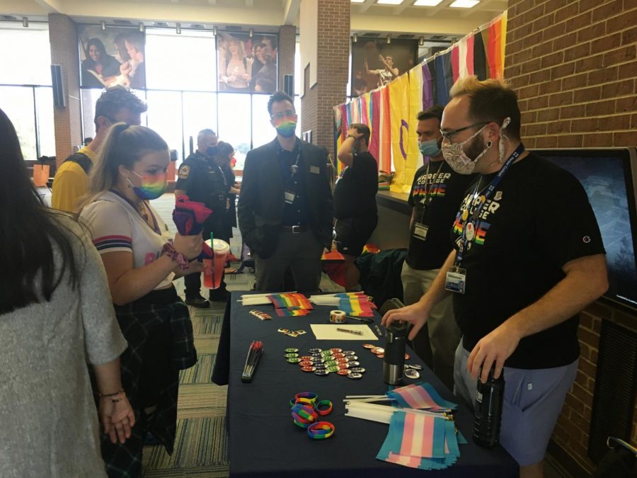 Students and staff interact at tables at Harpers Pride Fest on Oct. 11, 2021. Photo by Adriana Briscoe.