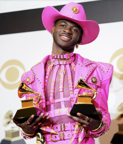 Lil Nas X poses with his two Grammy Award trophies. (photo courtesy of Getty Images)