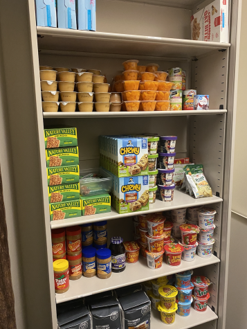 A shelf displays food at Hawks Cares food pantry in Building I. Photo courtesy of Ciera Murray.