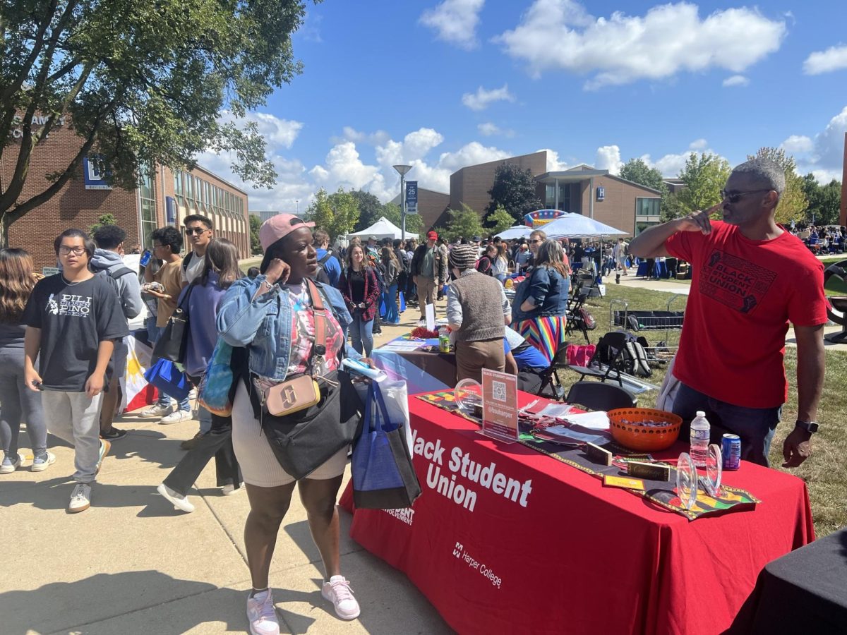 Taking over the Harper quad last week, Harper Hullabaloo is an event that allows student organizations, like the Black Student Union (pictured above), promote themselves and get to know new faces on campus. (Photo by Harbinger staff)