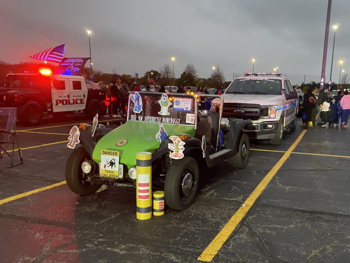 Organized by Campus Recreation and Harper Police, the second ever Trunk-or-Treat event didnt just boast cars full of candy: it was also a place for people to show off their Halloween-themed rides, such as this buggy themed after Monsters, Inc. (Photo by Jack Schafer)