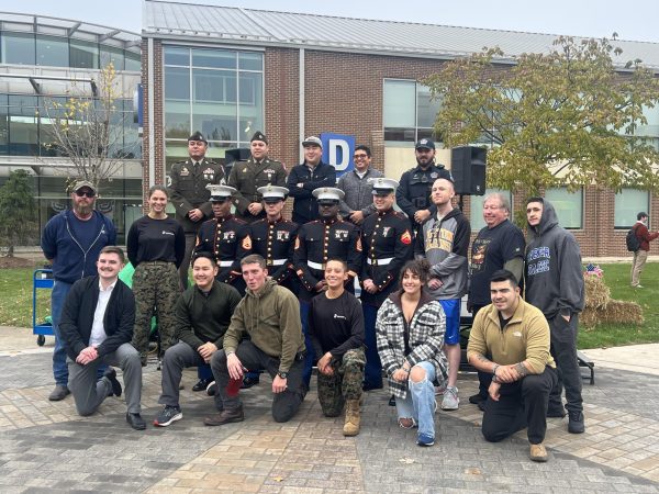 Participants in the Veterans Day Celebration held on November 8th, 2023 in The Quad at Harper College, pose for a group picture.