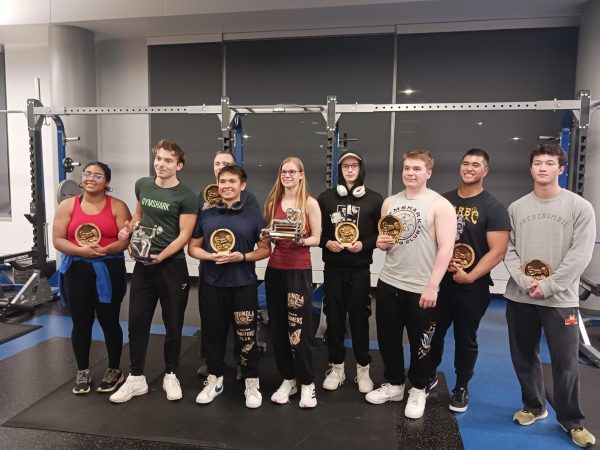 The winners of the second annual Bench Press Competition at the Foglia Recreation Center pose for a photo with trophies in hand. (Photo by Scott Solano)