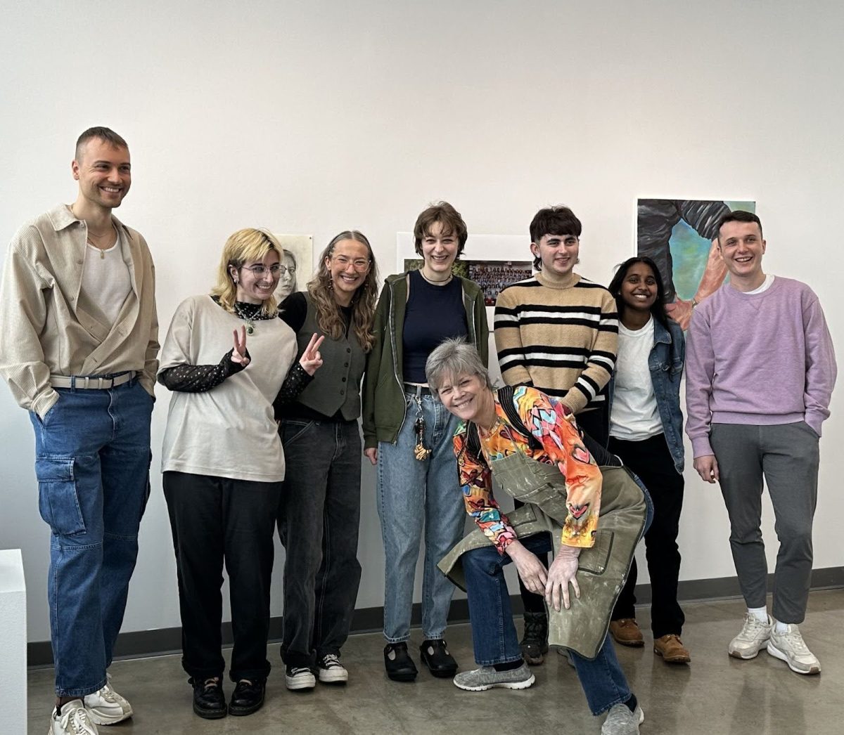 Cat+Reddington%2C+one+of+the+two+juror%E2%80%99s+award+winning+students%2C+in+the+striped+crewneck+standing+with+other+fellow+student+artists.+%28Photo+by+Bridgette+Fraga%29