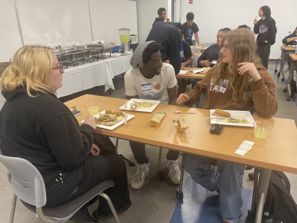 Three students converse at the Table Talk event on Oct. 14th, 2024. (photo by Sarah Matzkin)