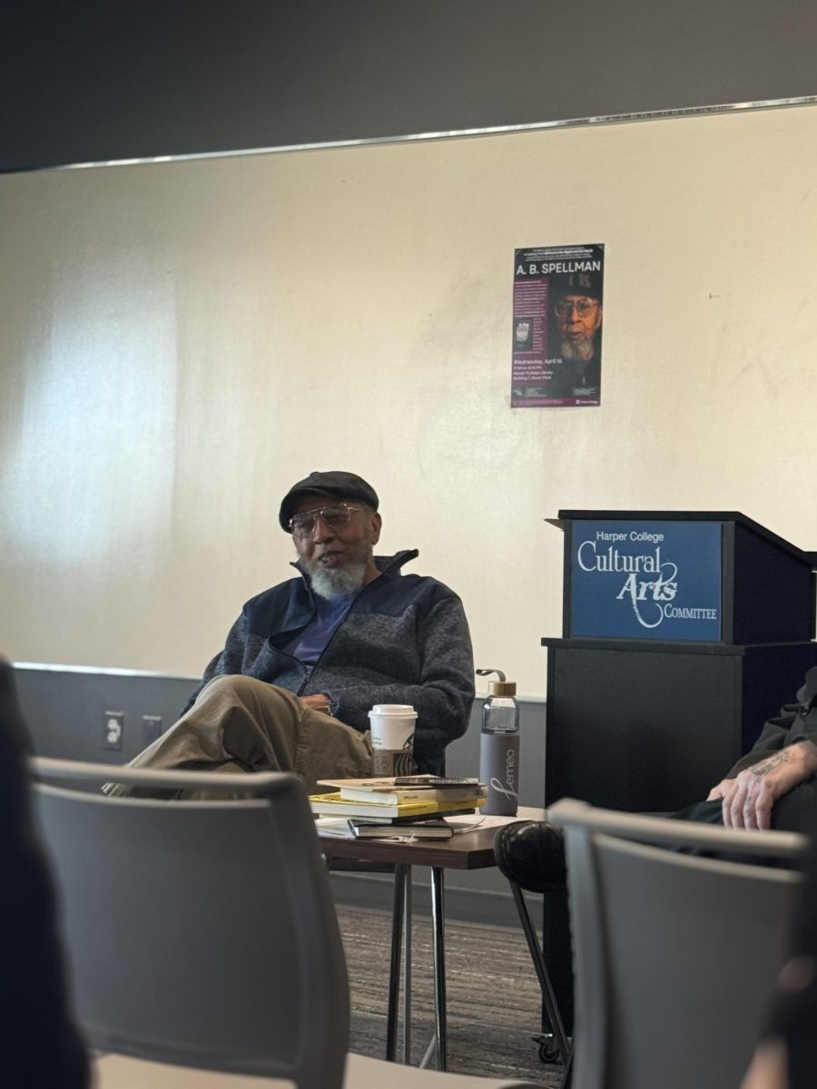 A.B. Spellman sits in room F226 as he introduces himself to the audience at the start of the A.B. Spellman Book Reading event on April 16, 2025. (Photo by Chelsey Villagomez)
