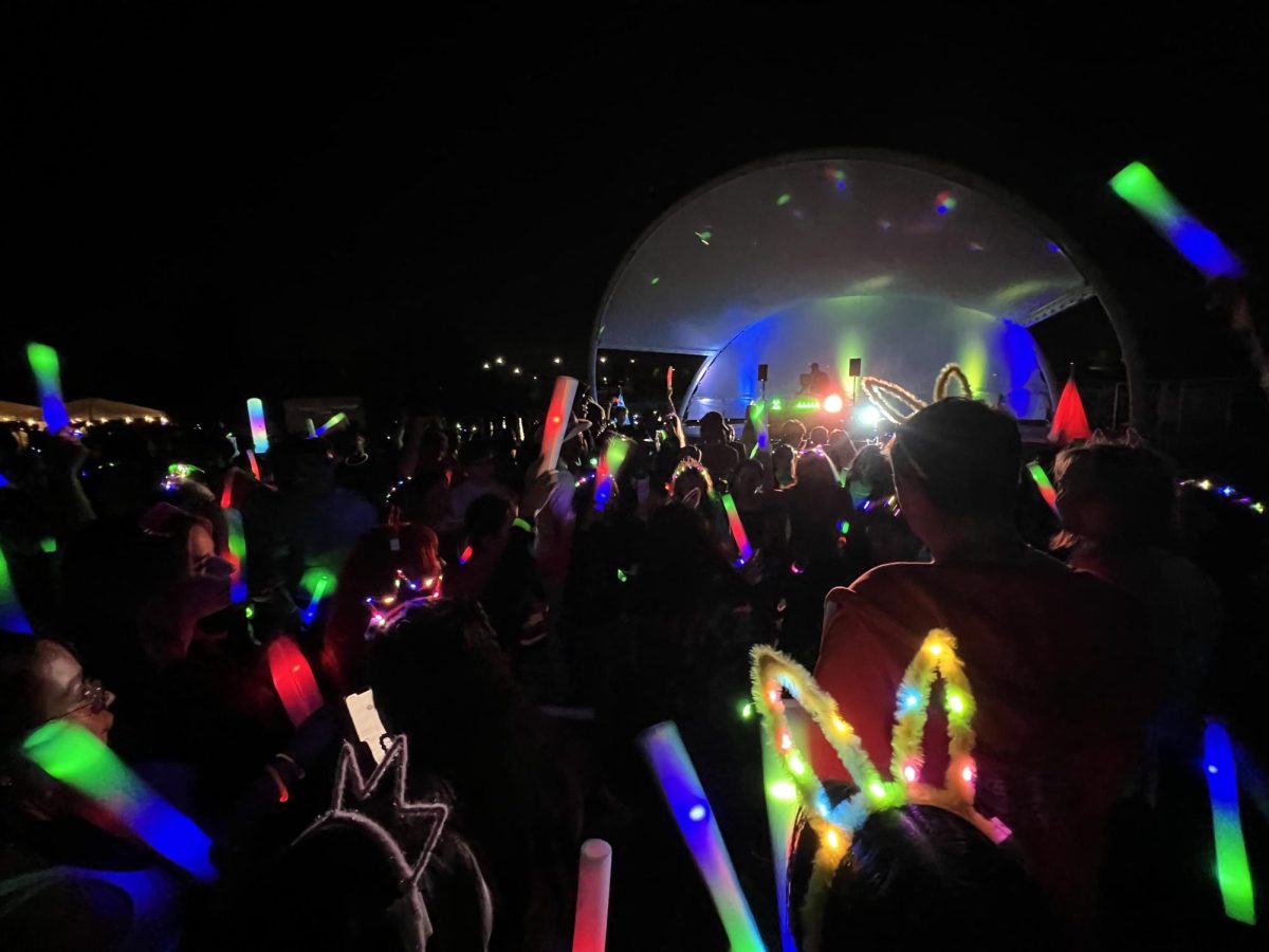 After dark, students are given neon lightsticks to dance with at the Neon Lights event on August 28th, 2025. (Photo by Hector Rodriguez)