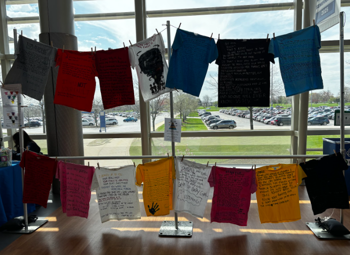 T-shirts created by survivors of sexual violence hang as part of the Clothesline Project at the Clothesline Project: Sexual Assault Awareness Month event April 22, 2025. (Photo by Evelyn Hernandez)
