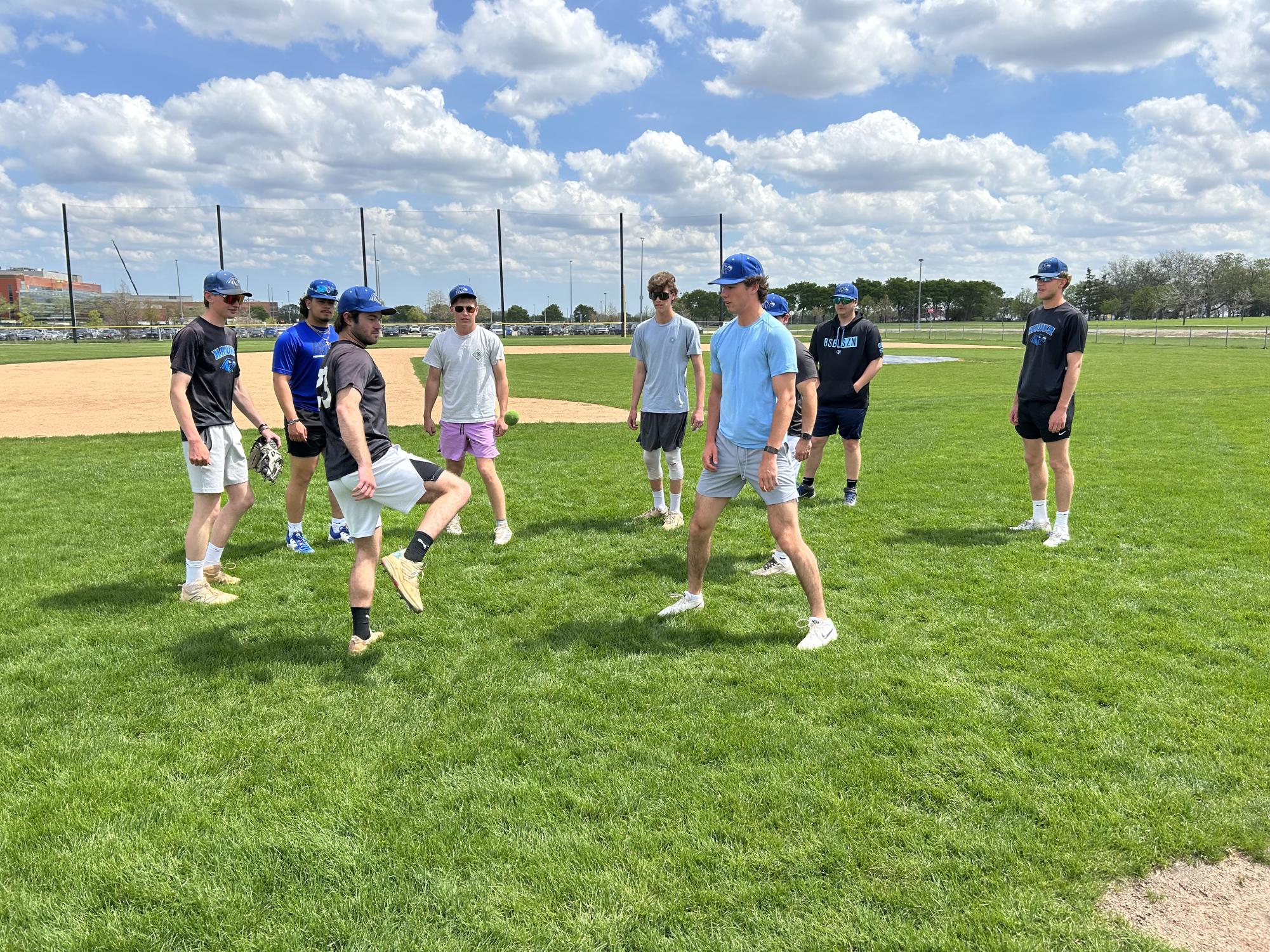 Several Hawks enjoy a game of hacky sack before the start of practice. (Photo by Ryan Contreras-Betz)